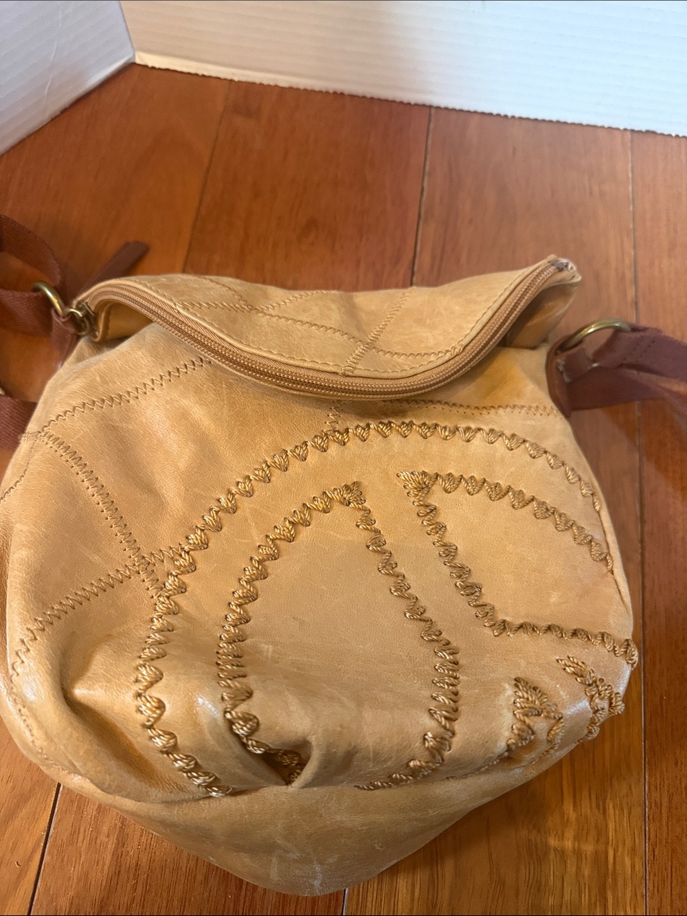 The Sak Deena fold-over crescent crossbody bag. tan leather peace sign stitch - Picture 11 of 11